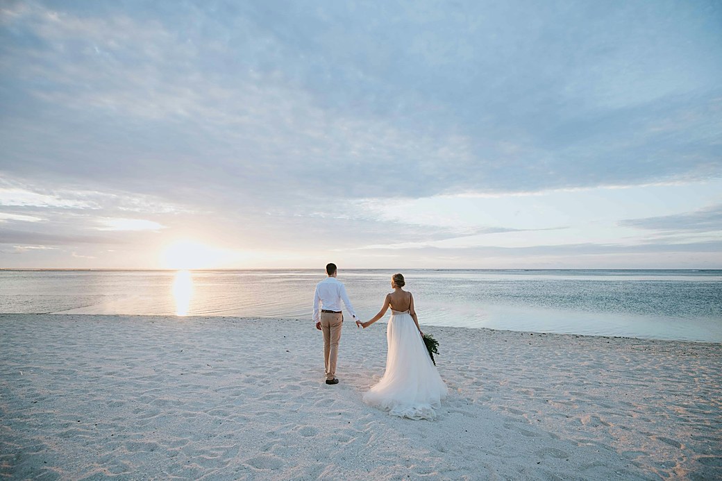 Beach wedding couple at sunset