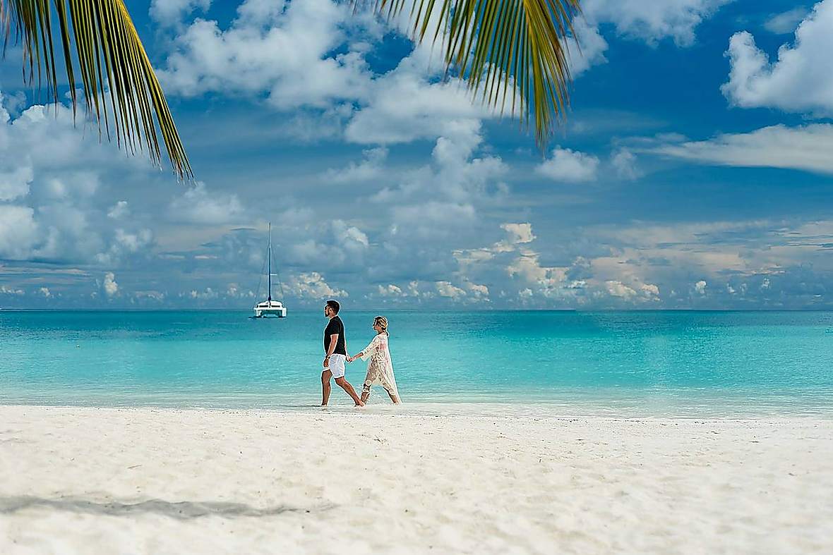 Honeymoon couple on a tropical Zanzibar beach