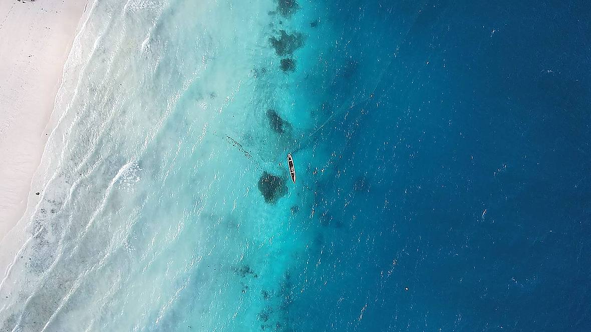 Aerial drone view of a turquoise Zanzibar beach